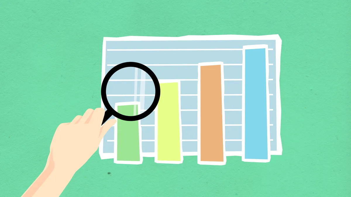 Magnifying glass over bar chart graphic