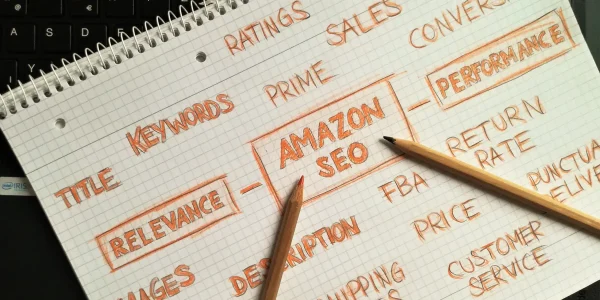 notebook page with handwritten SEO terms and pencils