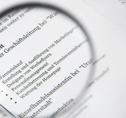 magnifying glass over a text document with bullet points